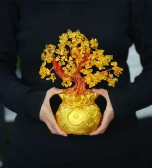 Unlock Wealth and Abundance with a Citrine Money Tree: Your Feng Shui Secret Weapon Are you feeling stuck in a financial rut? Is the energy in your home feeling stagnant? It's time to harness the power of feng shui with a citrine money tree! This dazzling gemstone ornament could be the key to unlocking prosperity and abundance in your life. What is a Citrine Money Tree? A citrine money tree is a powerful feng shui tool designed to enhance wealth energy in your space. Crafted with genuine citrine crystals, this ornamental tree is said to: Clear energy blockages Stimulate the flow of chi (life force energy) Create a welcoming environment for wealth and abundance The Magic of Citrine Citrine, often called the "Merchant's Stone" or "Success Stone," is renowned for its ability to: Manifest desires Attract success and good fortune Boost financial prosperity Its sunny golden hue radiates positive energy, making it a perfect addition to any home or office. Key Features of a Citrine Money Tree Energy Enhancer: Balances life force energy to improve various aspects of your life Genuine Citrine Crystals: Harnesses the stone's natural manifestation properties Versatile Decor: Perfect for shelves, tables, or near the front door Thoughtful Gift: Ideal for housewarming parties, weddings, or business openings Feng Shui Placement for Maximum Impact To maximize the citrine money tree's wealth-attracting potential: Place it in the southeast sector of your home or workspace Ensure it's visible and unobstructed Keep the area clean and clutter-free The Five Elements Balance The citrine money tree's leaves represent the five feng shui elements: Fire Earth Water Wood Metal This harmonious balance creates an optimal environment for chi to flow, promoting overall happiness and well-being. Amplify Your Intentions To supercharge your citrine money tree's effectiveness: Use wealth-attracting affirmations like "I am a powerful money magnet" Visualize your financial goals while focusing on the tree Express gratitude for the abundance already in your life Ready to Transform Your Financial Energy? If you're ready to welcome prosperity and abundance into your life, a citrine money tree could be the feng shui enhancer you've been searching for. By clearing stagnant energy and promoting the flow of chi, this beautiful ornament may just be the catalyst for positive change in your financial landscape. Remember, feng shui is about creating harmony and balance in your environment. The citrine money tree is not just a decorative piece – it's a powerful tool for aligning your space with your intentions for wealth and success. Are you ready to unlock the potential of your prosperity corner? Share your thoughts and experiences with feng shui in the comments below!